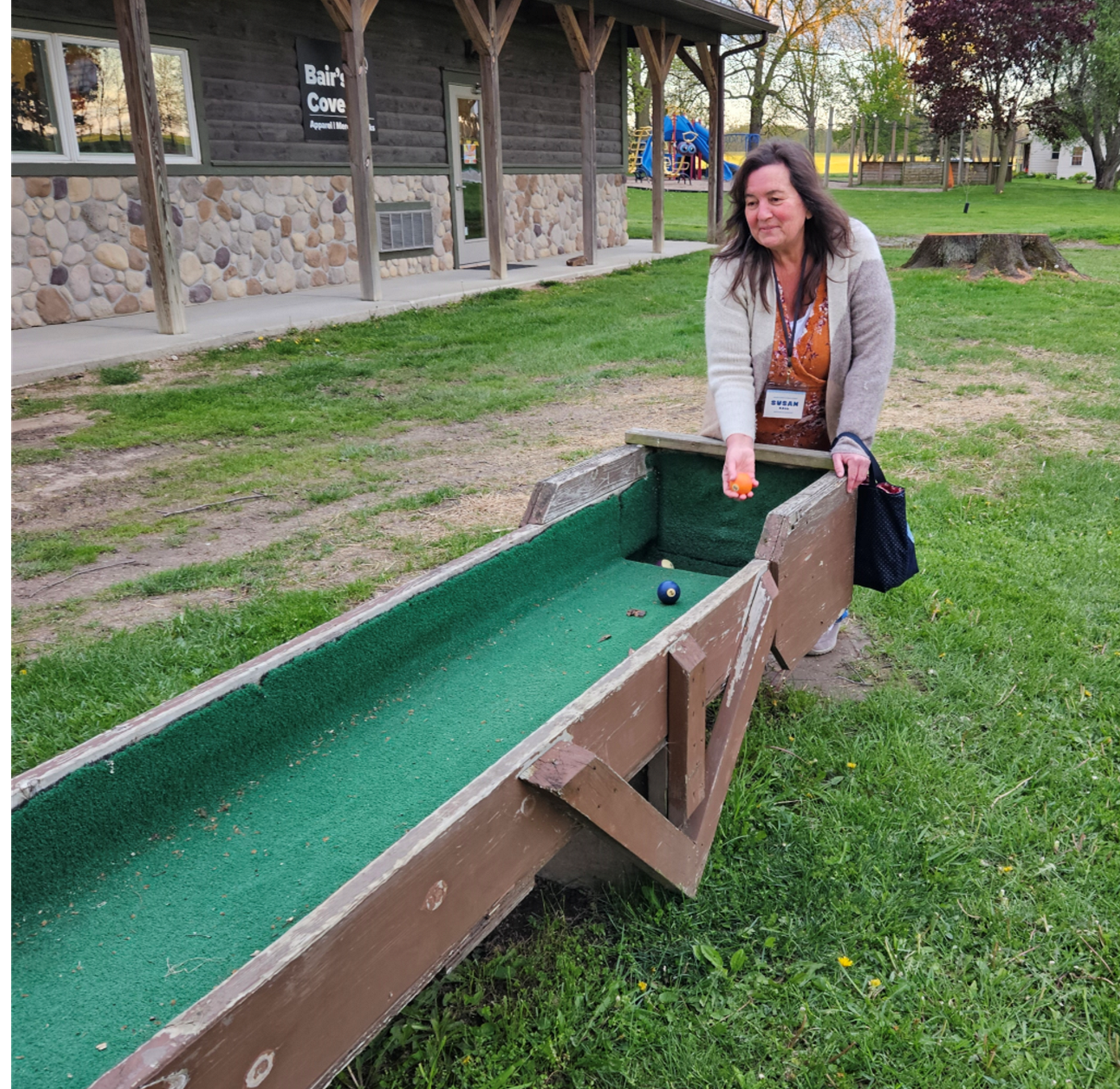 Susan playing carpet ball Canoe Activity at Bair Lake
